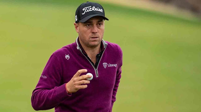 Justin Thomas walks off a green at the 2023 American Express in La Quinta, Calif.